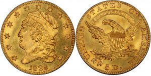 gold coin with liberty head and american eagle on opposite sides