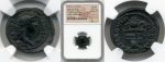close up to two sides of ancient roman coins in the packaging