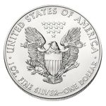 an eagle on the back of liberty standing silver coin worth one dollar